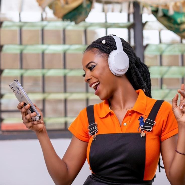 Avery Chen, Lead Design Curator at GraniteFrameUrban, reviewing corporate floral arrangements